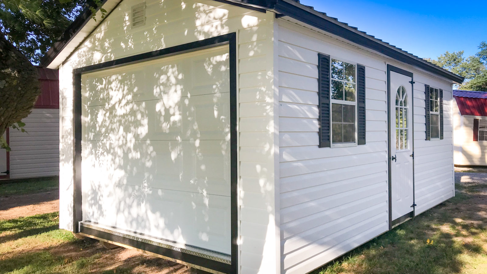 exterior of white prefab detached garage for sale