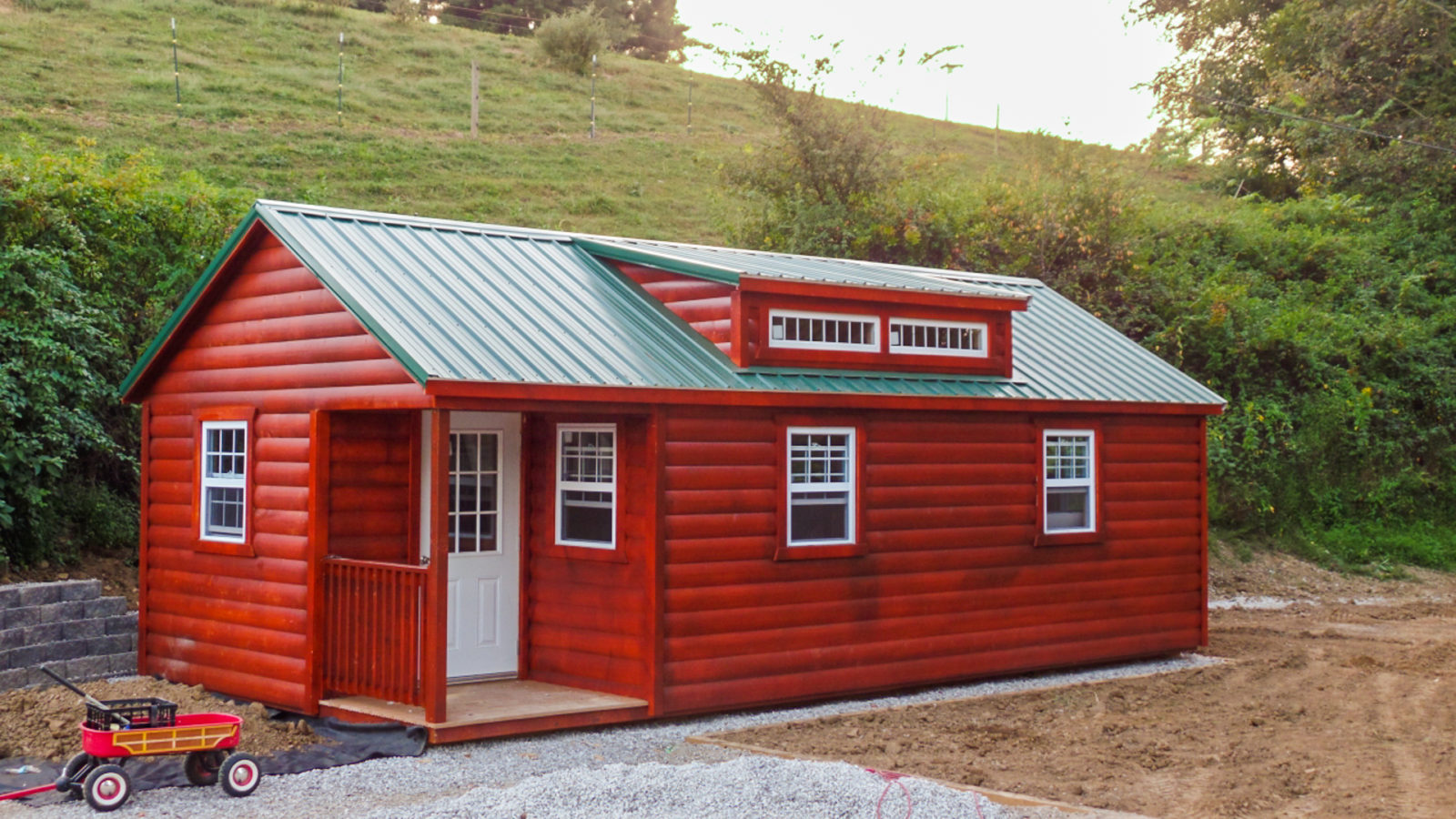 exterior of red rent to own cabin for sale