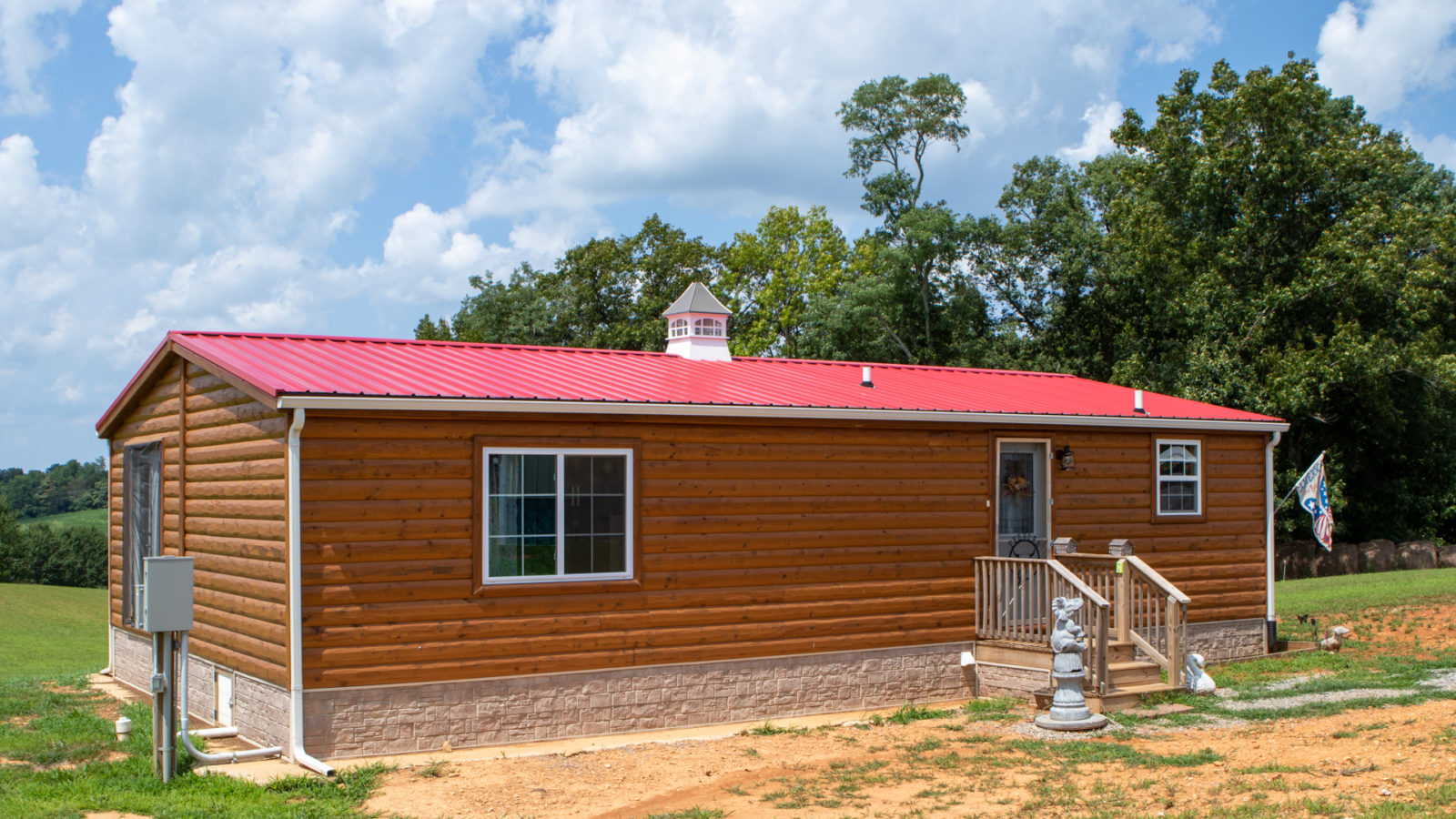 exterior of quality red roofed cabin for modular cabins for sale article