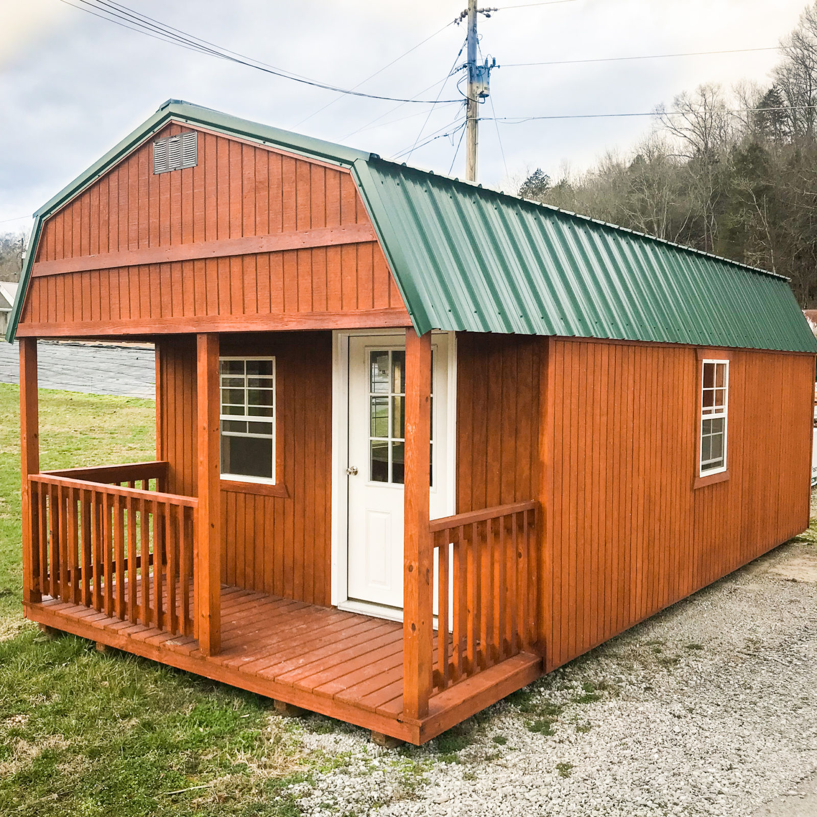 exterior of brown and green shed with porch for sale in TN