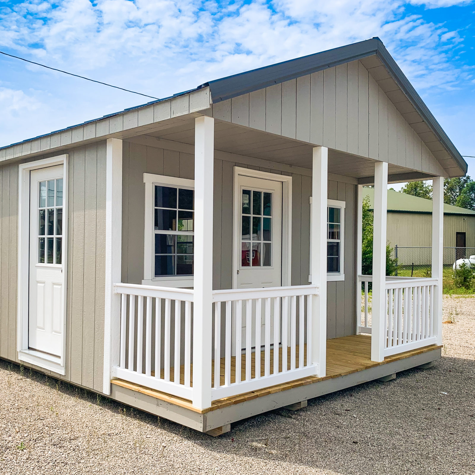 exterior of ranch cabin storage shed with porch for sale