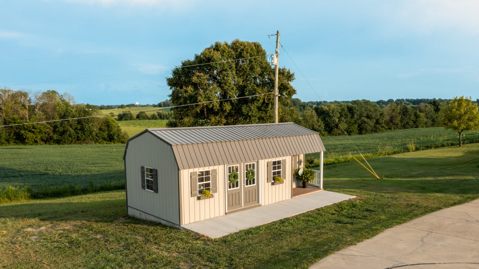 exterior aerial view of shed with porch for sale in KY and TN