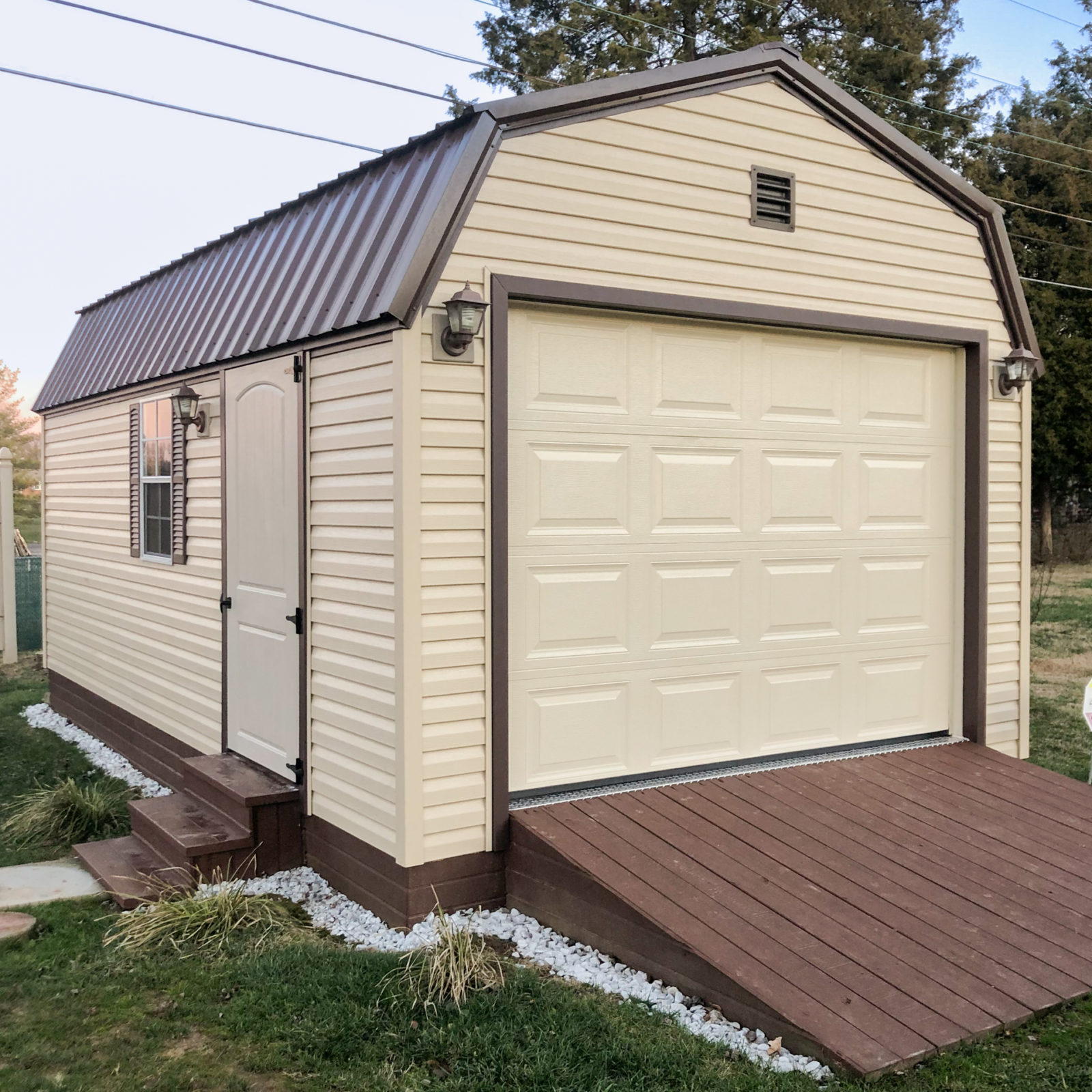 exterior of brown gambrel-roofed 1-car garage size for sale