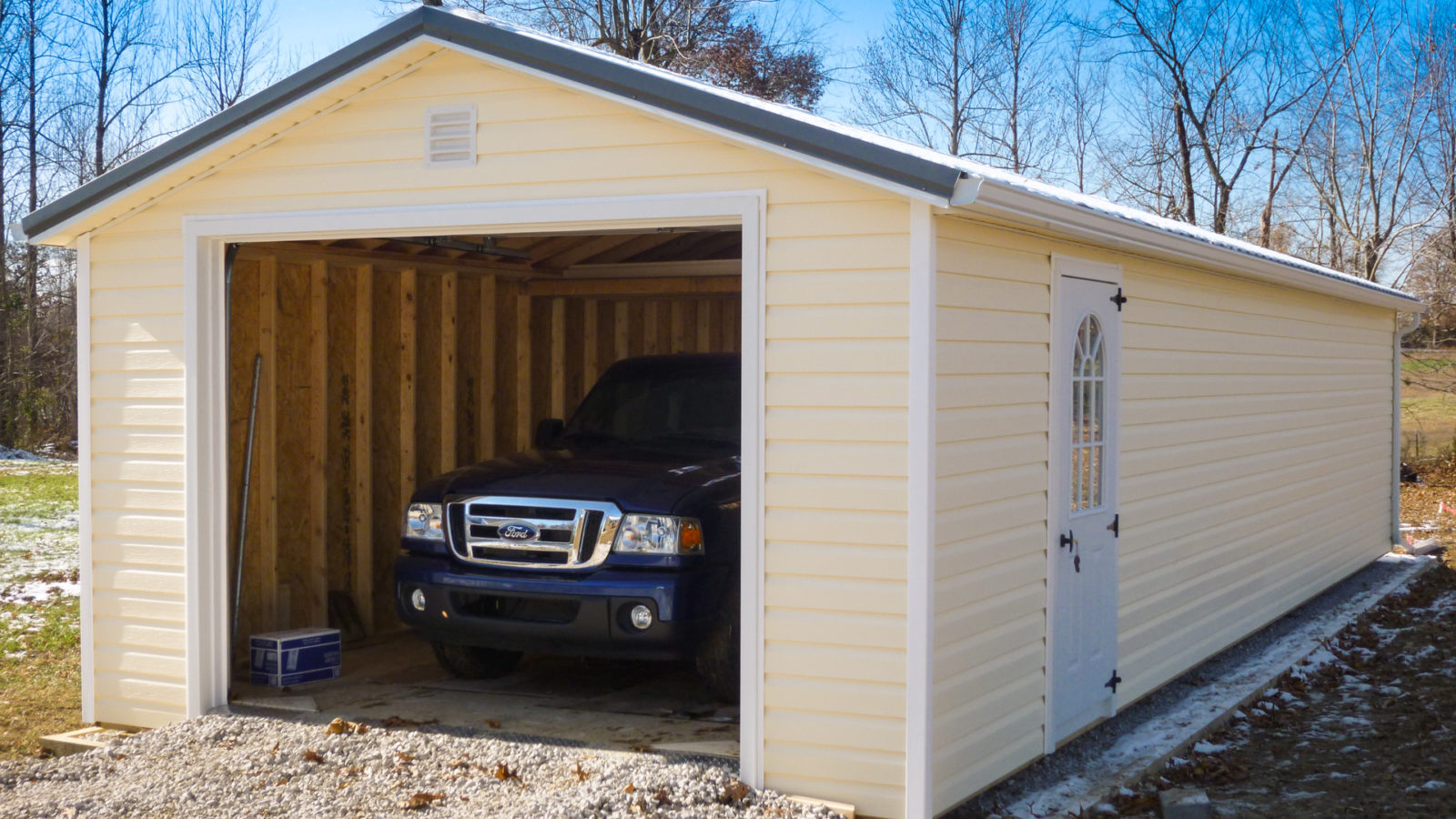 exterior of yellow single-car garage sizes for sale at KY and TN