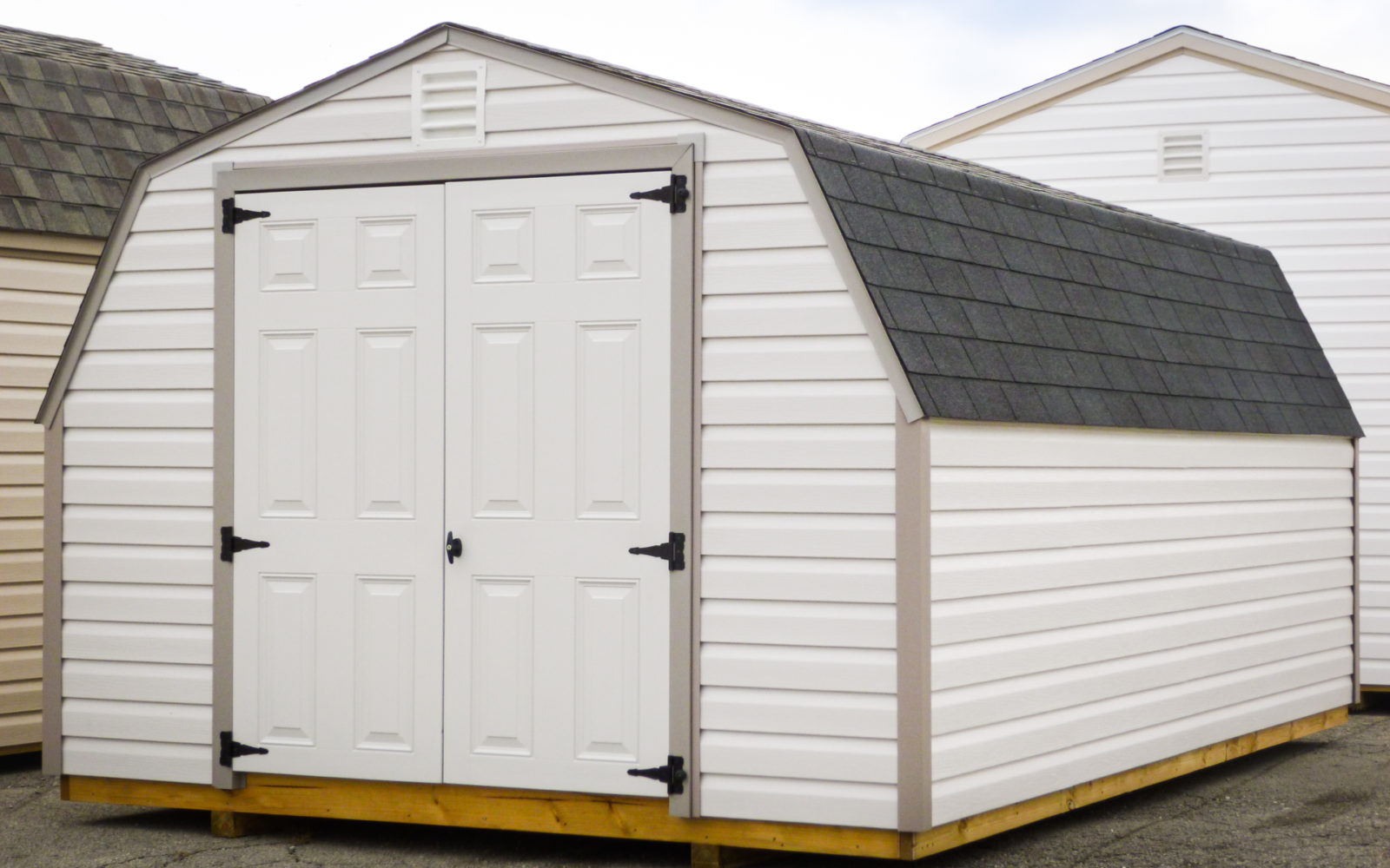 exterior of white and black 14x20 shed for sale