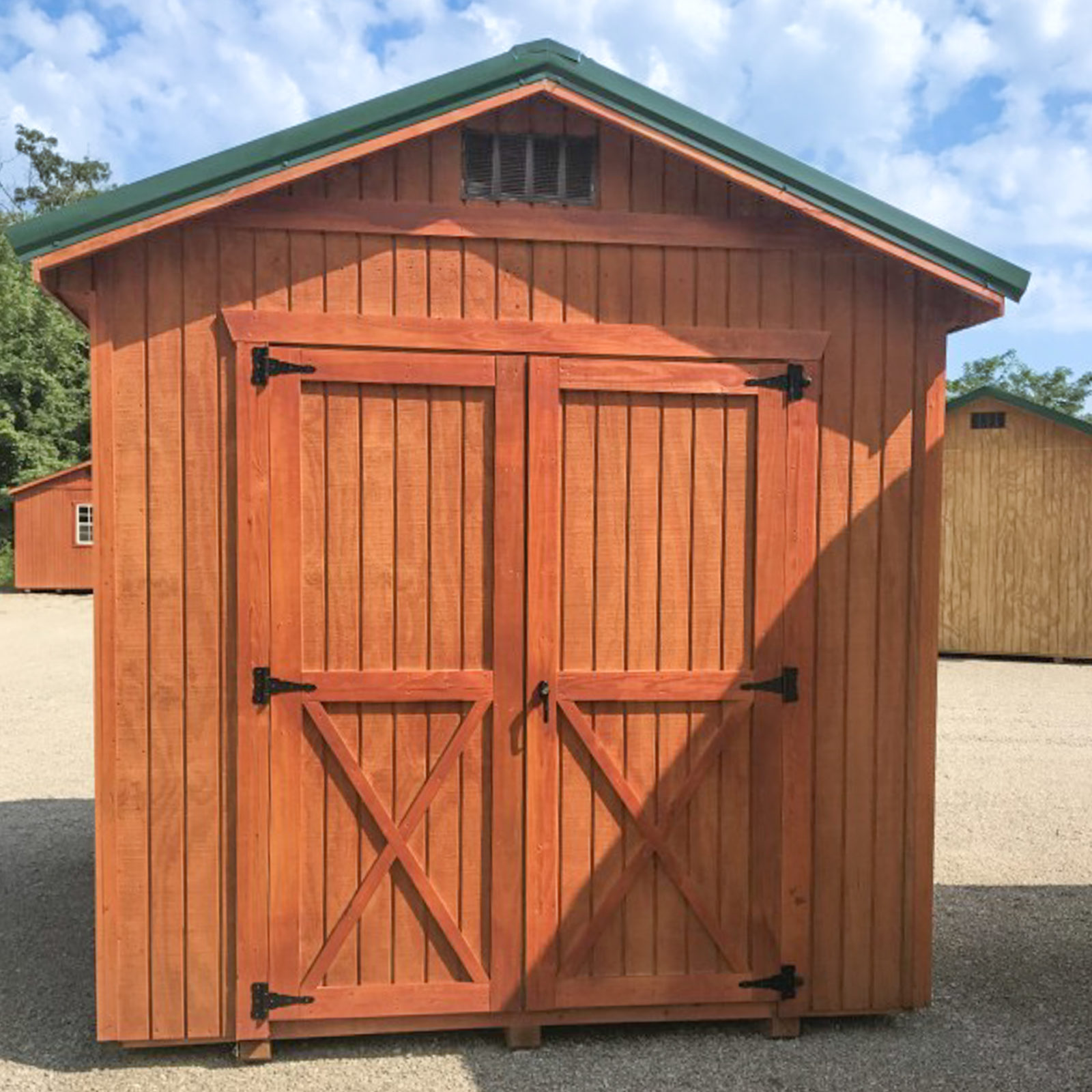 exterior of red small shed for lawnmower