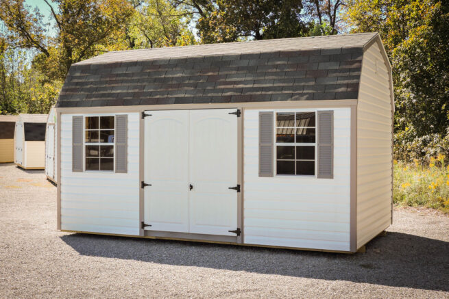 A white and tan gym shed with windows.