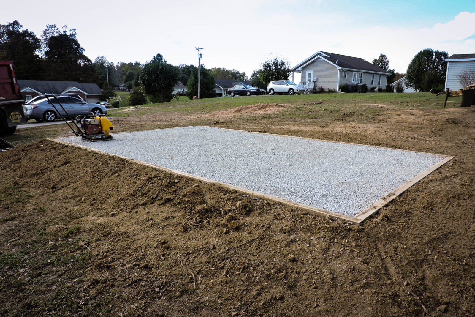 A gravel foundation for modular garages.