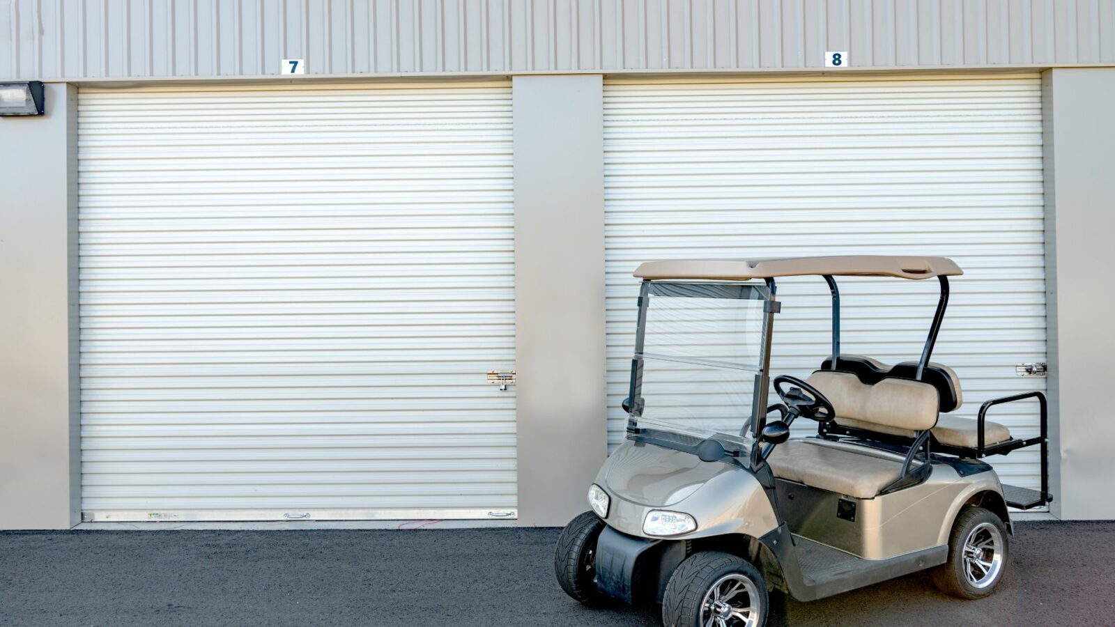 a golf cart in front of a garage