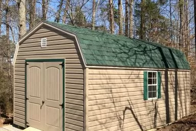 A portable building in Kentucky with vinyl siding and a green roof