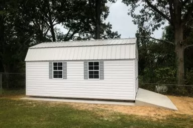 A lofted shed for sale in Kentucky with a concrete foundation