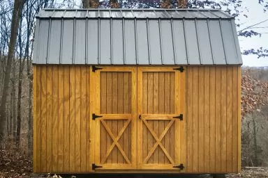 A lofted shed for sale in Kentucky with wood siding