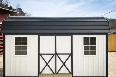 A portable building in Kentucky with metal siding and a black metal roof