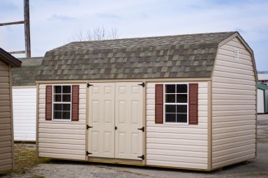 A shed in Kentucky with vinyl siding and a shingle roof