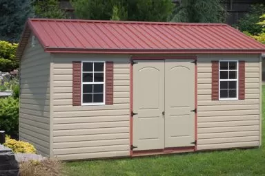 A shed in Kentucky with vinyl siding and a red metal roof