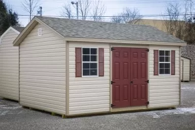A shed in Kentucky with vinyl siding and double doors