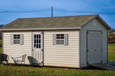 A shed in Kentucky with windows and double doors