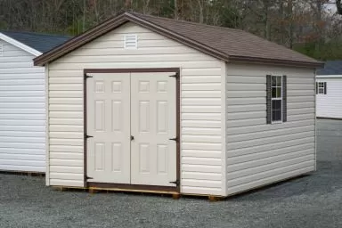 A shed in Kentucky with vinyl siding and double doors on the end