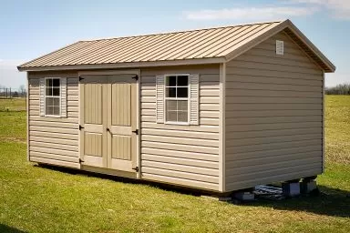 A shed in Kentucky with vinyl siding and a metal roof