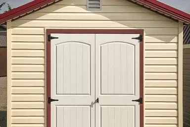A shed in Tennessee with vinyl siding and double doors
