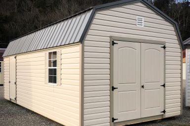 An outdoor shed in Kentucky with vinyl siding, a loft, and a metal roof