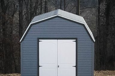 An outdoor shed in Kentucky with vinyl siding and double doors