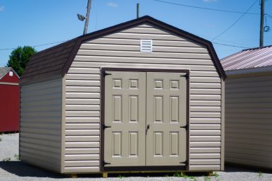A storage building in Tennessee with vinyl siding and double doors