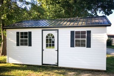 A portable garage in Kentucky with windows and a metal roof