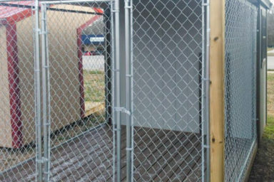A prefab dog kennel for sale in Kentucky with a chain link dog run