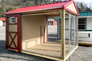 A prefab dog kennel for sale in Tennessee with a red metal roof