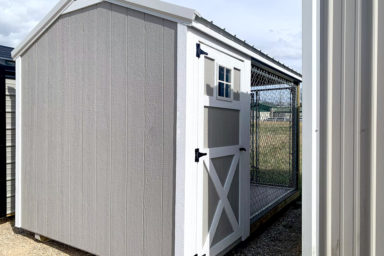 A gray prefab dog kennel for sale in Tennessee