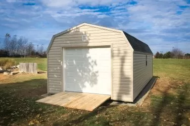 A prebuilt garage in Tennessee with vinyl siding and a ramp