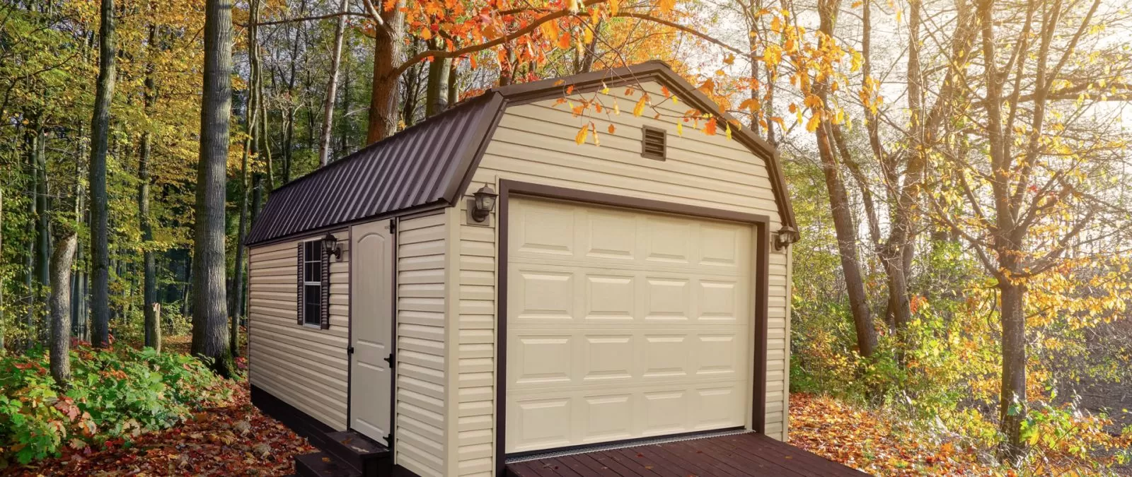 A custom prebuilt garage in Tennessee with brown vinyl siding and a loft