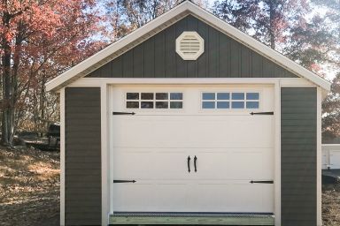 A prefab garage shed in Tennessee with custom vinyl siding