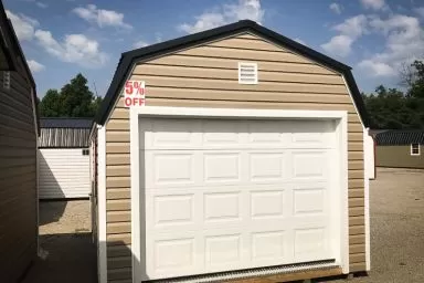 A discounted prefab garage in Kentucky with vinyl siding and a loft