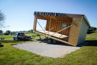 A modular garage in Kentucky being set on a gravel foundation