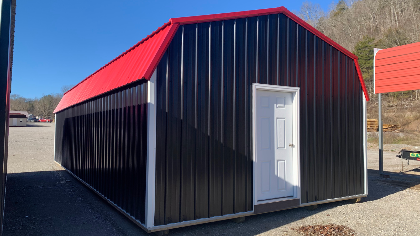 exterior of black and red shed for sale at KY and TN for outdoor shed cost article